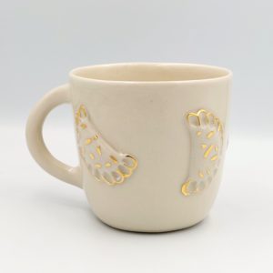 kubek ceramiczny pozłacany z pierogami